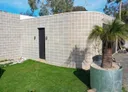 A curved block retaining wall built by Ash Huskisson Masonry